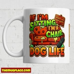 White mug with colourful text: If I'm sitting, I'm a ChairClaim. Dog Life, with an illustrated sofa and remote.